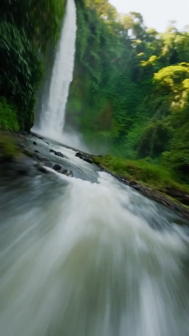 FPV Dive Through a Waterfall